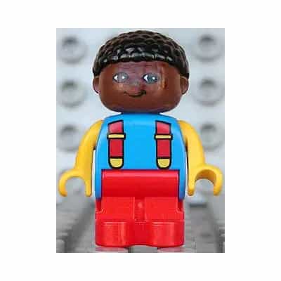 Duplo Figure, Child Type 1 Boy, Red Legs, Blue Torso with 2 Straps, Yellow Arms, Brown Head with Black Curly Hair