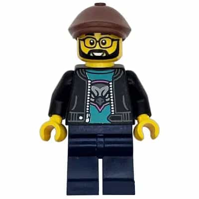 Race Truck Driver - Male, Black Jacket over Dark Turquoise Shirt with Hawk Head Logo, Dark Blue Legs, Reddish Brown Flat Cap, Beard, Glasses